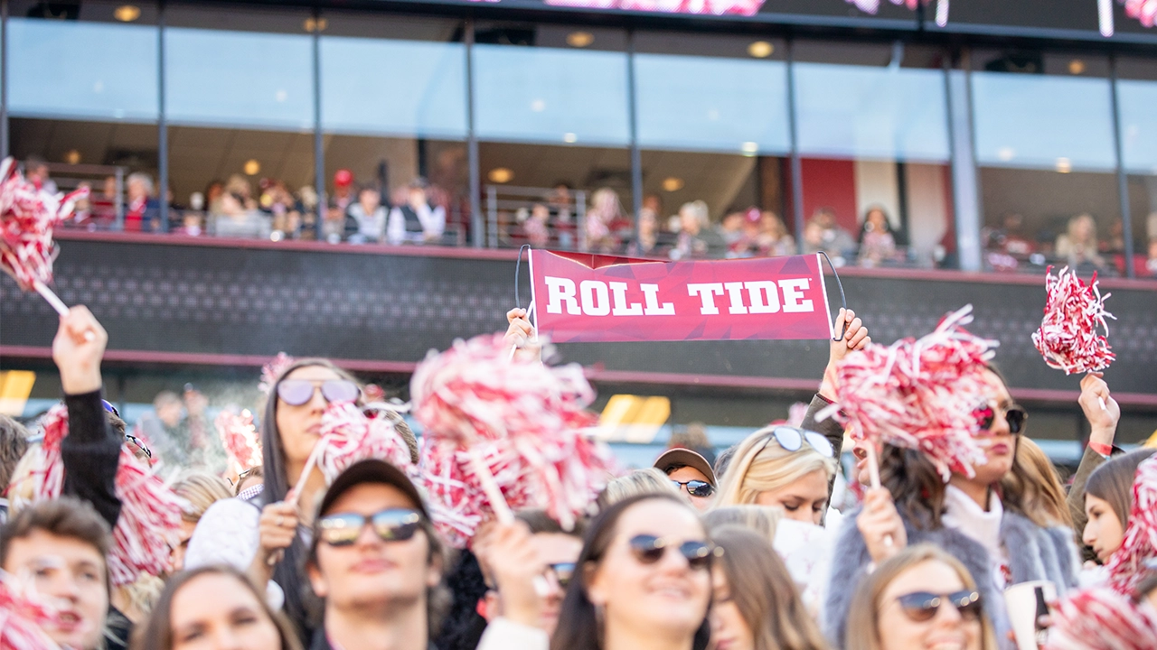 Students cheering at Bryant-Denny Stadium